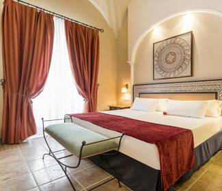 Quarto junior suite Hotel ILUNION Mérida Palace