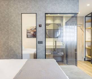 Quarto duplo superior com sala de estar hotel ilunion san mamés bilbao Quarto duplo superior com sala de estar hotel ilunion san mamés bilbao